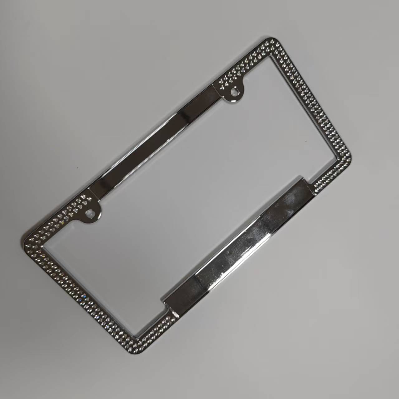 Zinc alloy die-casting electroplating diamond-encrusted license plate frame