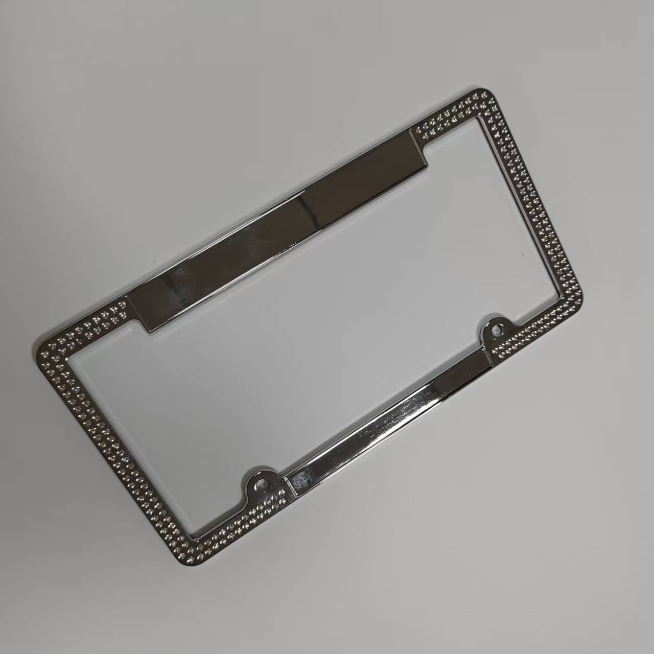 Zinc alloy die-casting electroplating diamond-encrusted license plate frame